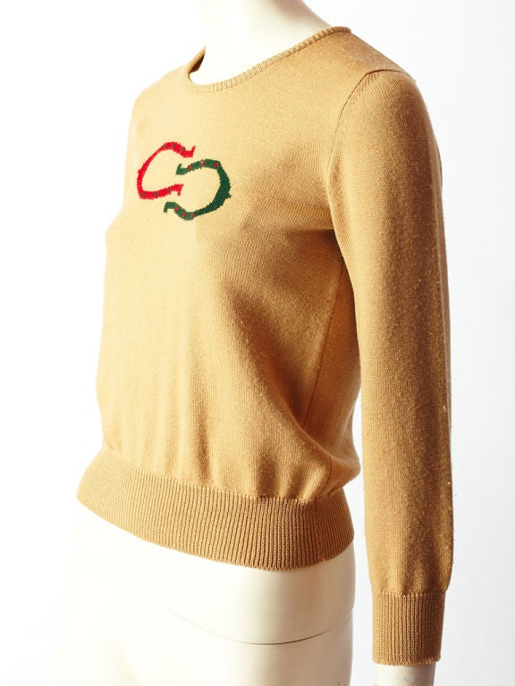 Vintage, beige wool knit, crew neck, <br />
horseshoe logo, sweater c. 1970's