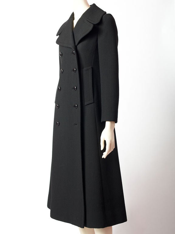 Origianla wool double breasted. fitted maxi coat. Back details include half belt and box pleating.