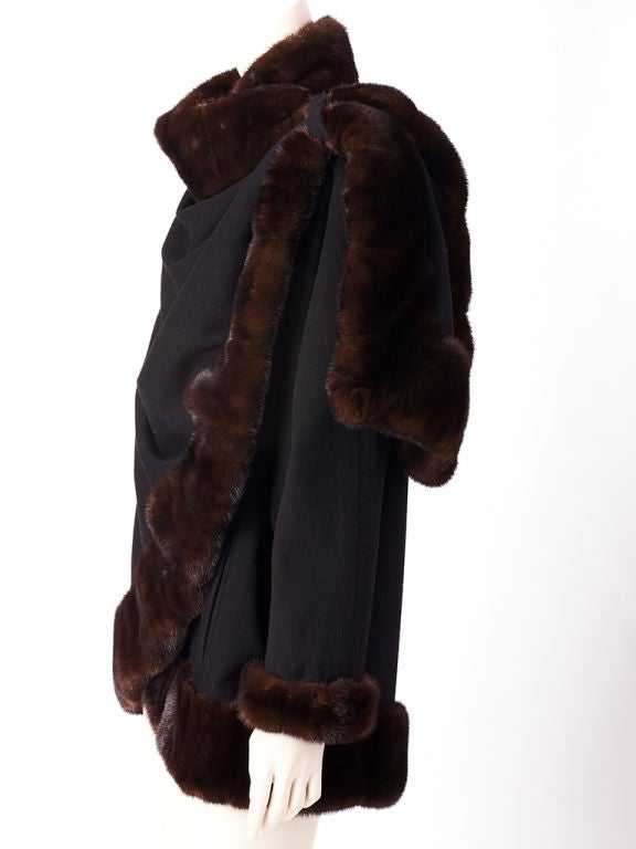 J.Mendel black cashmere cape/jacket with mink trim, along neck,<br />
sleeves and hem. High 