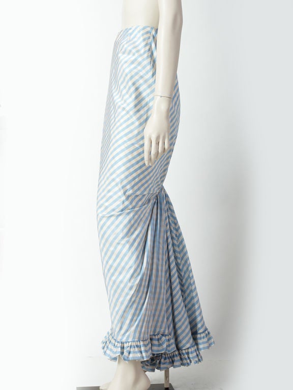 Oscar de la Renta, Robins egg blue and ivory stripe taffeta bustle<br />
style evening skirt with ruffled hem.