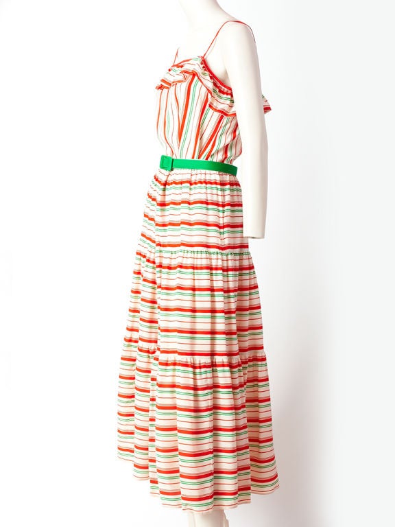 Miss O, Oscar de la Renta 2 piece, striped silk dress. Top has<br />
spaghetti straps with a ruffle detail at the bust and skirt is full with tiers. Green gross grain belt finishes the ensemble.