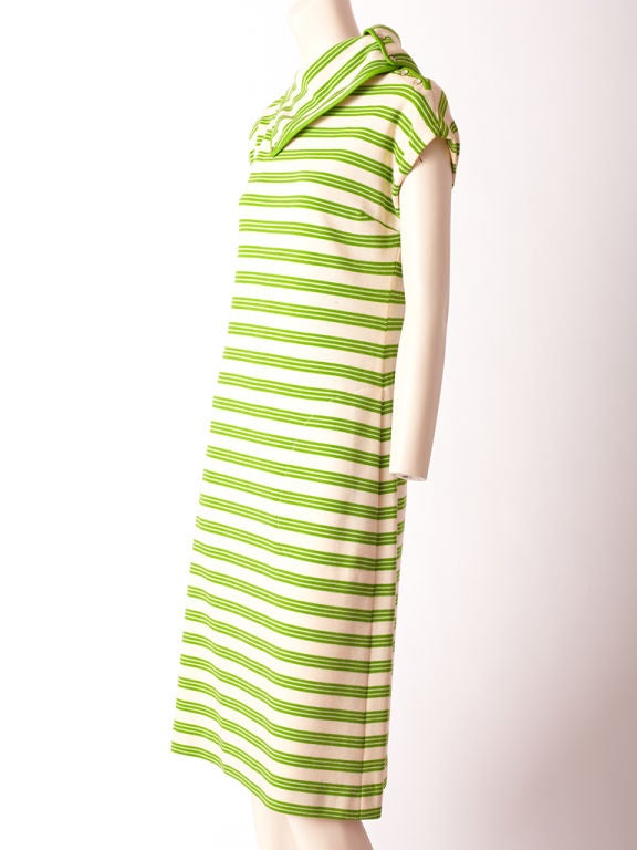 Bonnie Cashin wool knit, lime green and white horizontal stripe ,<br />
cap sleeve, dress with leather trim at neck.Dress has snaps along<br />
shoulder and neck,making the neckline flexible in shape.Rounded stitched in pockets are another