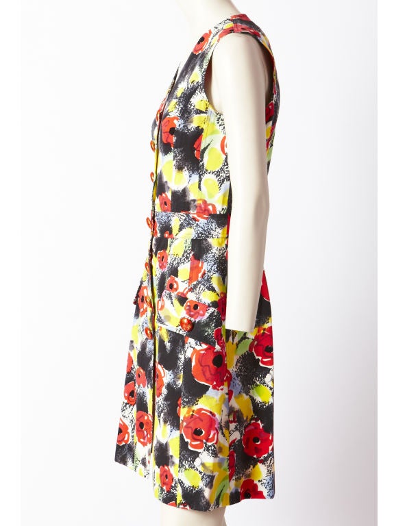 Chanel, abstract, red poppy floral pattern, v neck, sleeveless , button front, denim dress with red porcelain 