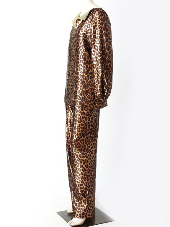 Donald Brooks, bronze tone. lame, leopard print tunic and pant ensemble.Tunic has a front, middle slit that ties, with a slight <br />
gathered shoulder and full sleeve that fastens at the wrist.<br />
Pant has is straight with a