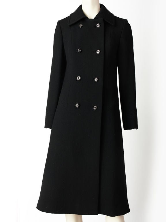 Pierre Cardin, double breasted, A line shaped, wool, coat with inverted pleat detail at the sides staring at the hip and going down to the hem.
