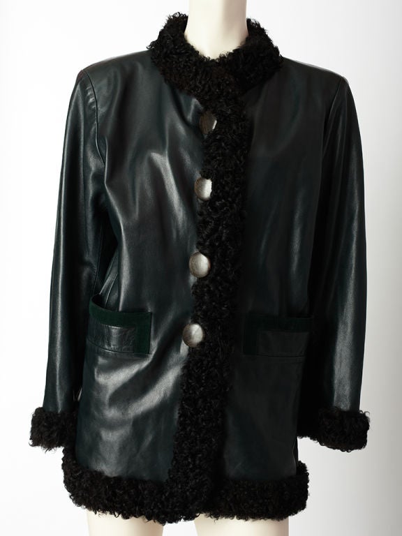 Yves St.Laurent, deep teal blue, leather jacket with black curly 
lamb trim. Hip pockets are trimmed in teal blue suede and large round buttons are polished wood.