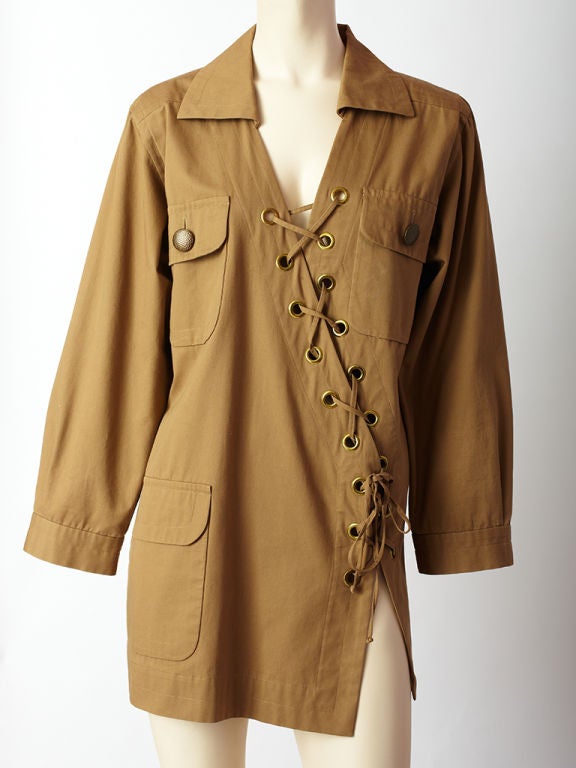 YSL, rive gauche, oversize, cotton, khaki, safari tunic with breast pockets and asymmetric, lacing and grommets detail. C. 1980's.
