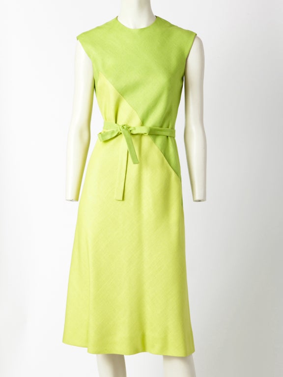 Pauline Trigere, linen, bias cut, belted day dress with 
2 tones of lime green, geometrically  cut placement.