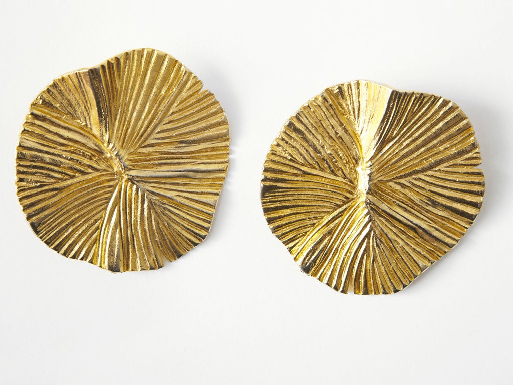 YSL, large circular textured, gold tone clip on earrings C. 1980's. 2 1/2