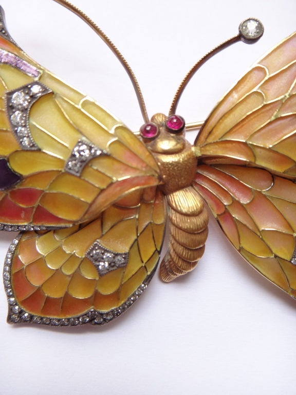 set with 131 old-cut diamonds weighing 2,53 carats,2 rubies cabochons weighing 0,24 carats, 18K yellow gold and silver, weight 41g