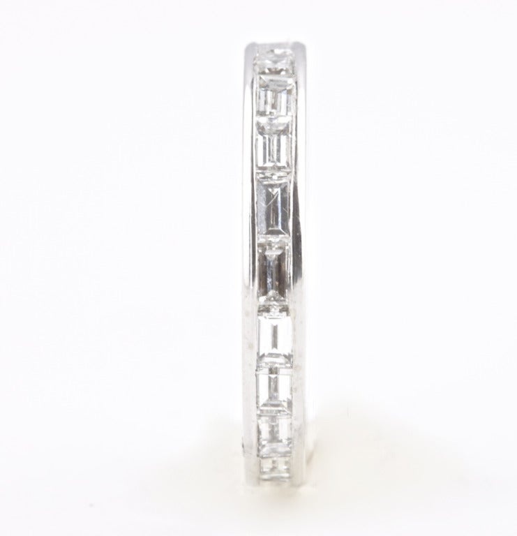 14k white gold eternity band. 20 emerald cut diamonds weighing approximately 1.50 carats. The diamonds are well made, white and clean.

Ring size is 6 1/2 and can not be re-sized.