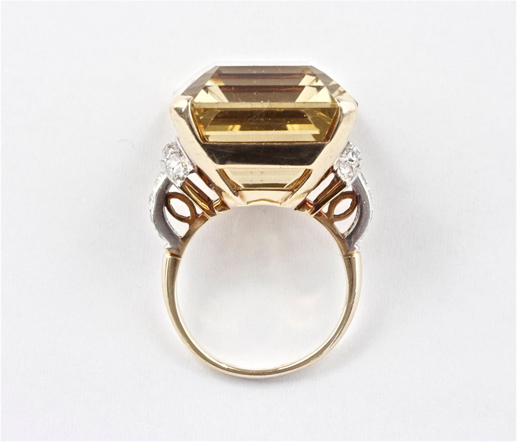 Well shaped citrine weighing approximately 50 carats with 20 white round diamonds weighing approximately 0.80 carats. Stamped 14k and platinum.

Size 7 and can be re-sized