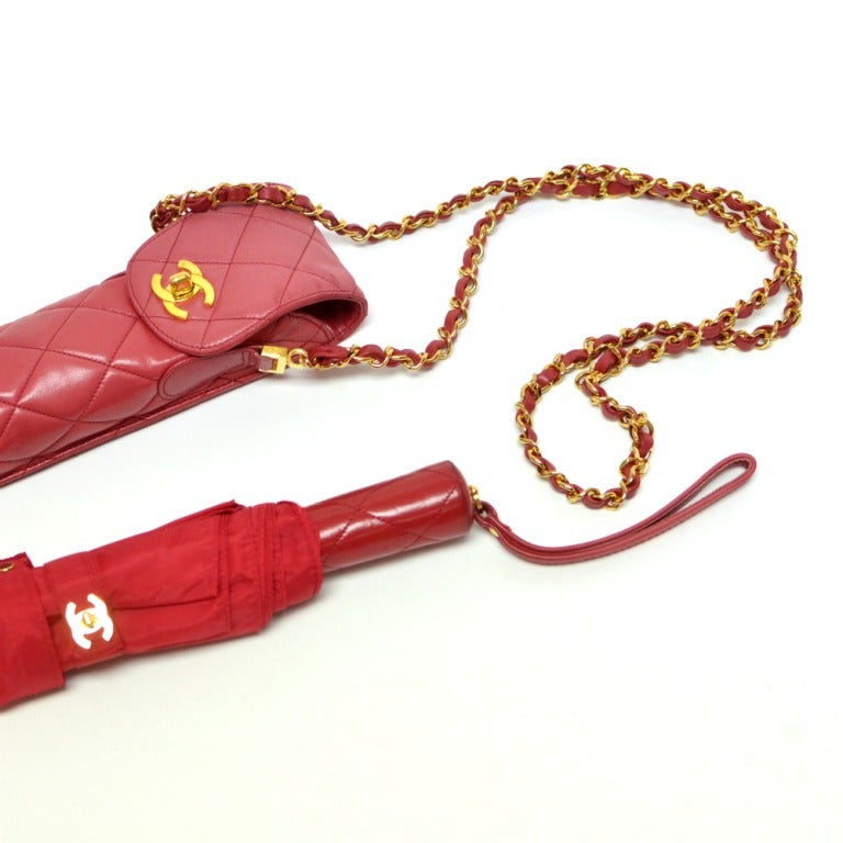 Authentic Chanel Umbrella Red Calf Skin Leather Case with Chanel Umbrella

Color : Red
Hardware: Gold
Leather: Calf Skin Leather Case
Measurements : Height: 3, Width: 18, Depth: 2
Condition: Good