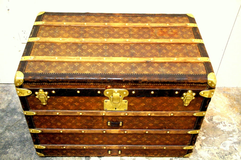 Unique Louis Vuitton Petite 32 inch steamer trunk.  It has the early hand woven linen monogram LV canvas.  Circa 1897 with provenance from Louis vuitton.  Top of the line model with all brass hardware, leather trim, and zinc bottom.  Complete with