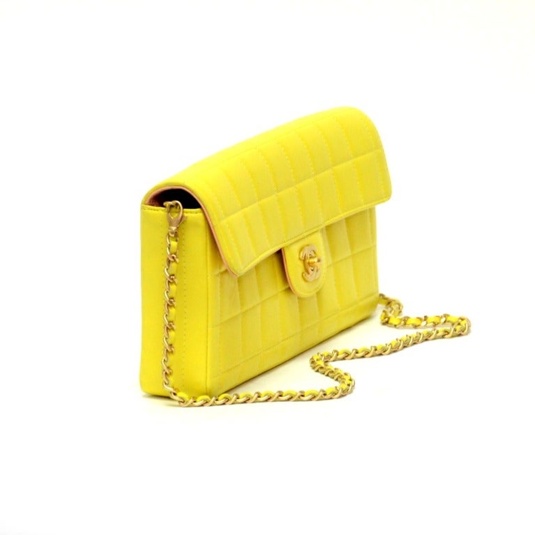 Brand: Chanel
Leather: Yellow Quilted
Hardware: Gold
Chain Shoulder