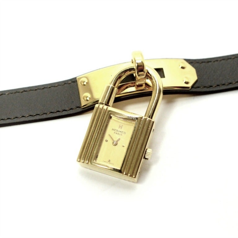 BRAND: Hermes 

MODEL: Kelly 

METAL: Gold Plated 

BAND: Brand New Hermes Black Double Tour Strap.

DATE CODE: 