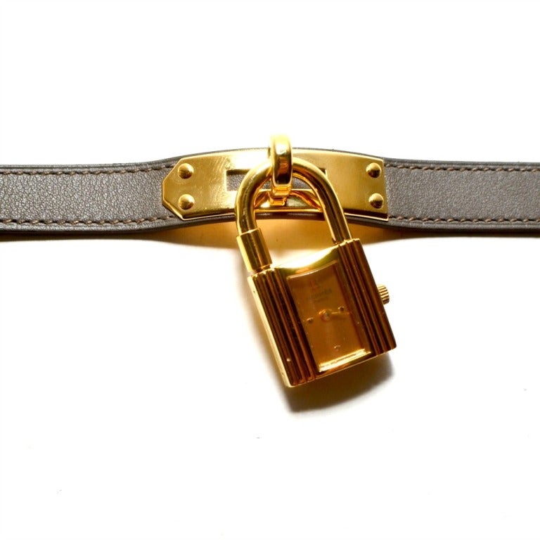 BRAND: Hermes 

MODEL: Kelly 

METAL: Gold Plated 

BAND: Brand New Hermes Grey Double Tour Strap.

DATE CODE: 