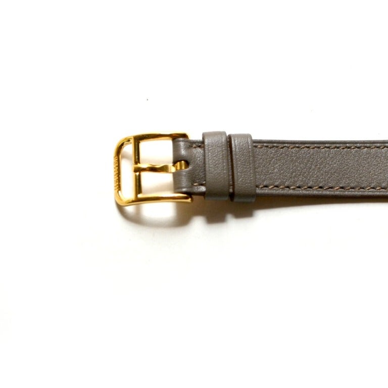 Contemporary Hermes Kelly Gold Plated Watch Grey Double Tour Strap. For Sale