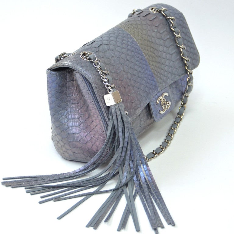 Authentic Chanel Flap in Iridescent Python with Pink, Green and Blue hues on Silver Python with Silver Hardware and Fringe attachment on strap. 
Color: Silver Iridescent
Material : Python
Measurements : 10