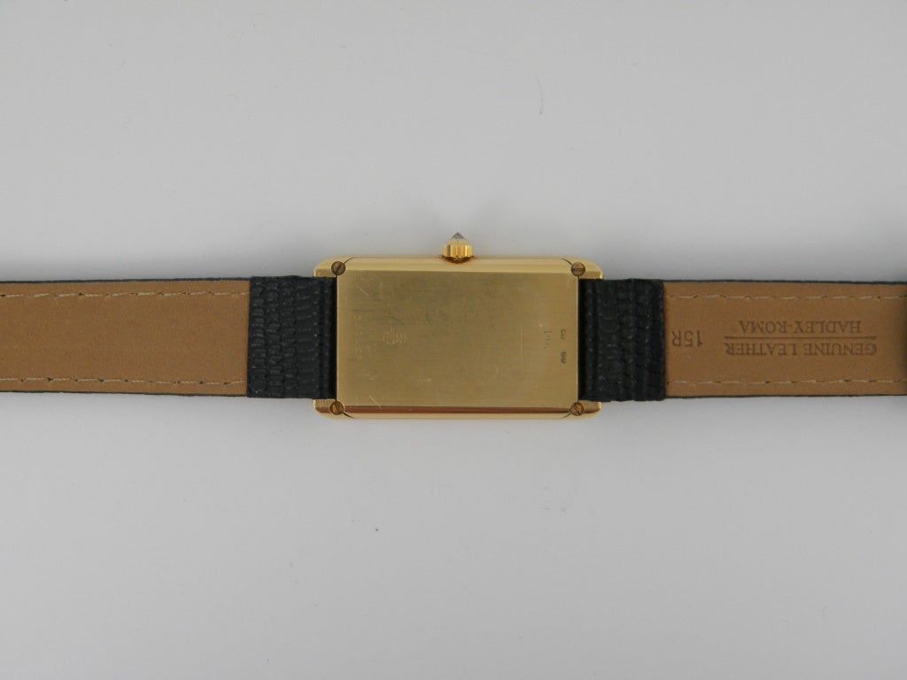 Corum 24k and 18k yellow gold Ingot wristwatch, manual-wind movement, 21mm x 35mm. 18k case and 24k dial, sapphire crystal, custom strap and buckle. Corum papers and pouch. One year full warranty.