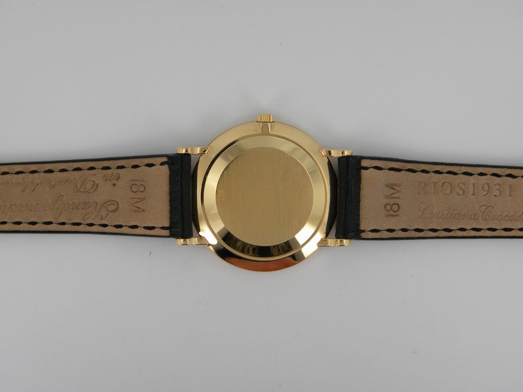 Patek Philippe 18k yellow gold Calatrava wristwatch, manual-wind movement, 33mm. Ref. 5022J, champagne Guilloche dial, applied gold Roman numerals, subsidiary seconds dial, sapphire crystal, Patek Philippe buckle. One year full warranty.
