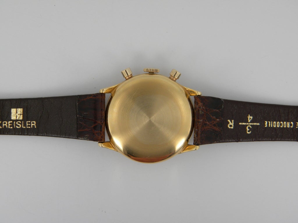 Universal 18k yellow gold Stellaris chronograph wristwatch, manual-wind movement, 35mm. Ref. 3456, silvered dial, baton indexes, chronograph function, custom strap, original 18k tang buckle. Six months full warranty.
