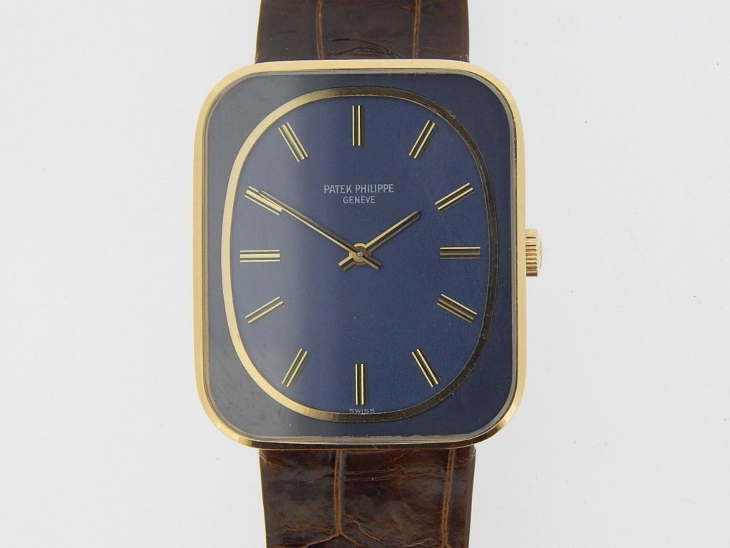 Patek Philippe 18k yellow gold Ellipse wristwatch, manual-wind movement, 34mm x 29mm. Ref. 3582 with blue dial, caliber 23-300pm movement. Circa 1964. Six months full warranty.