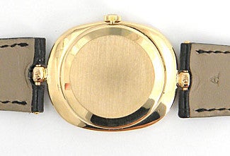 Patek Philippe 18k yellow gold Ellipse wristwatch, manual-wind movement, 32mm x 27mm. Ref. 3546 with 18k yellow gold case, champagne dial with baton indexes, black Patek Philippe strap. Circa 1980s. Six months full warranty.