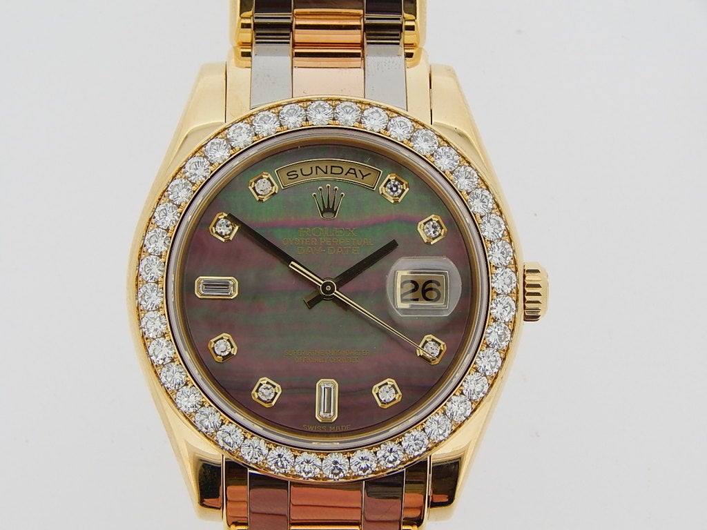 Rolex Tridor Masterpiece with automatic movement, size 39mm. Rolex Ref. 18948 with 18k yellow gold case with 18k tri-color bracelet, sapphire crystal, 40 diamond bezel set in yellow gold, black mother of pearl diamond dial. Box and papers. Circa