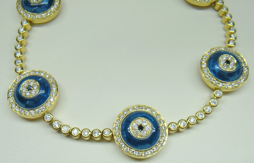 Genuine Lorraine Schwartz evil eye bracelets. Covered by multiple celebrities. 
All eyes are a brilliant blue topaz (the color of protection) with a  black diamond pupil and  full-cut brilliant, bezel set diamonds make up the body of the bracelet.