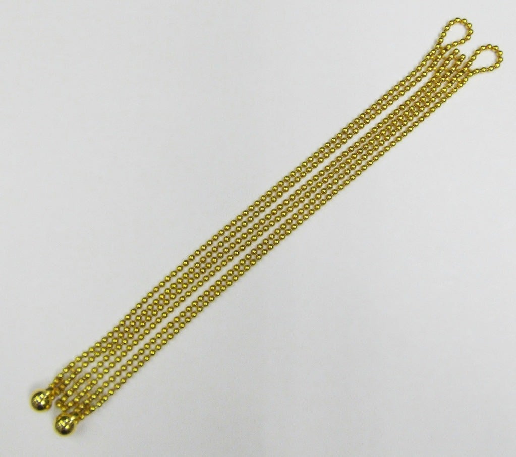 The necklace designed as ten strands of 18K yellow gold beads, completed by a button and loop fastening, length 14 1/2 inches, signed Cartier, numbered 03-914583; together with a six-strand bracelet of similar design, length 7 1/4 inches, signed