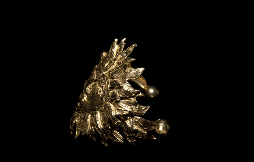 Gold plated cuff signed by Jean Cocteau