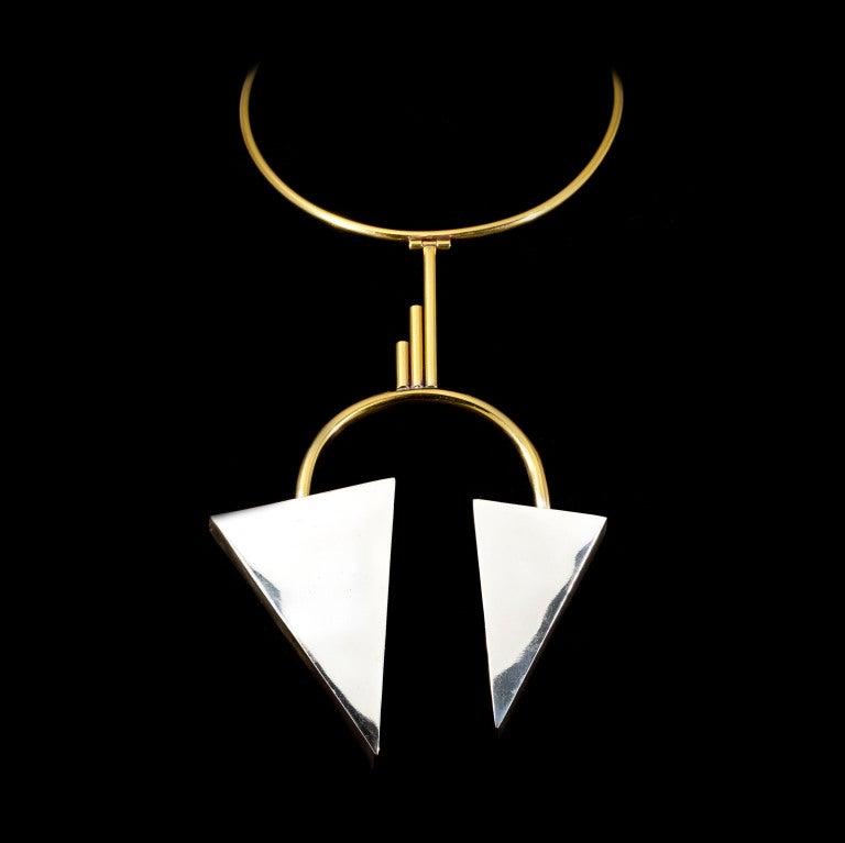 This unique Roger Bahih necklace is from the 1970s and features an asymmetric arrow bib