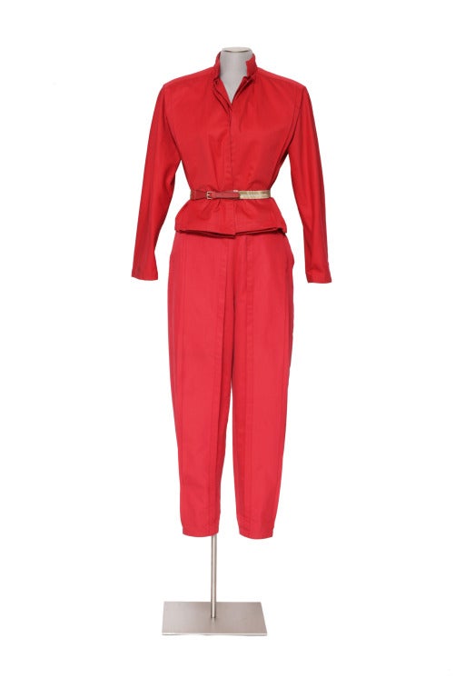 This is a true collectors item. Early Gianni Versace red cotton suit with original belt. Both jacket & trousers are labeled Italian size 40. In excellent condition