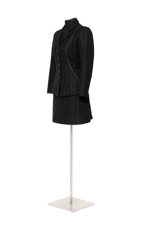 90's Alaia wool 2pc pinstripe suit with accordion pleats at back of skirt.
Jacket & Skirt = Size US 4 - UK 8