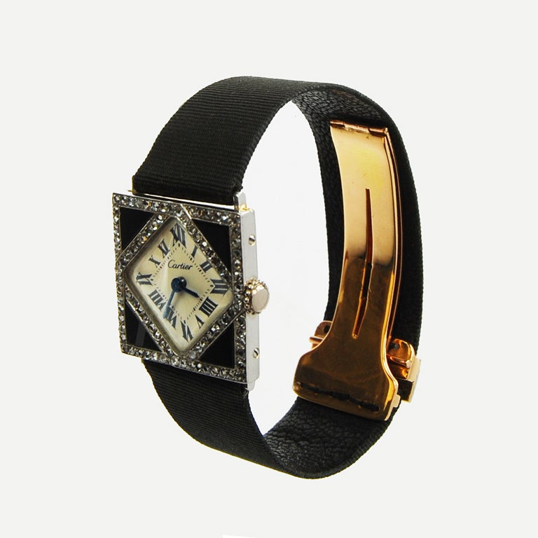 Art Deco Cartier Lady's Platinum, Diamond and Onyx Wristwatch For Sale
