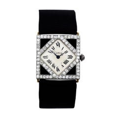 Antique Cartier Lady's Platinum, Diamond and Onyx Wristwatch
