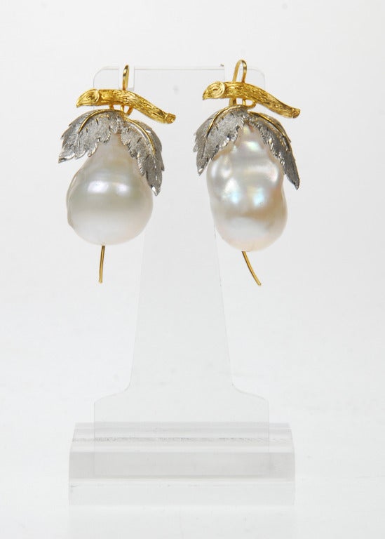 Baroque pearl earrings with 18ct white and yellow gold leaf design tops, made by Abigail Sands.