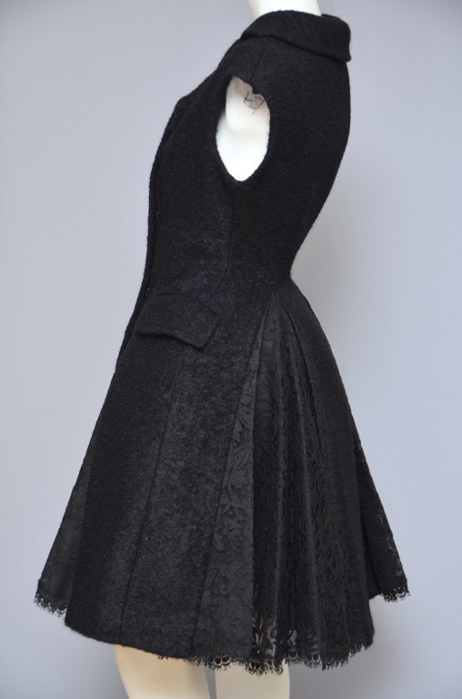 Alexander Mcqueen Black Sleeveless Runway 2008 Wool Coat  With Lace Panels Or Inserts.Three Button Closure In The Front And Two Pockets. 
This Is A Rare  '08 Runway Piece .Must Have For Any Alexander Mcqueen Collector. Runway Model Was Styled With