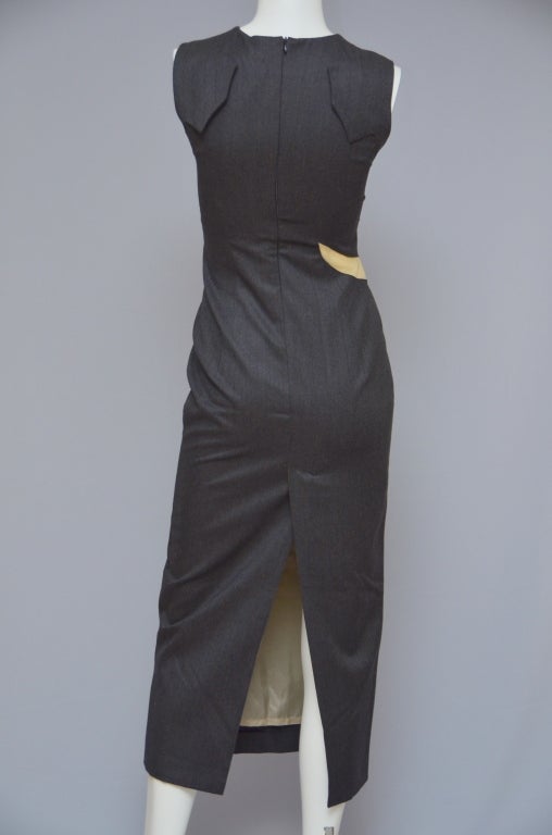 Alexander McQueen sleeveless cutout maxi dress from 2002.
Made in italy.Size 40IT.
Dress is new excellent condition without tags.Fabric color is dark grey in person and it has tiny dark brown/burgundy lines.Crew neckline.Sheer mesh cutouts along