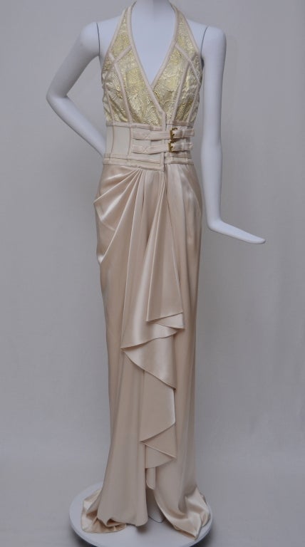 Balenciaga nude/peach/gold dress.Size tag missing .Excellent condition.Corset built in with 2 buckles closures in the front.
Bottom part of the dress has heavy silk fabric that falls beautifully.Stunning dress in person.
Dress