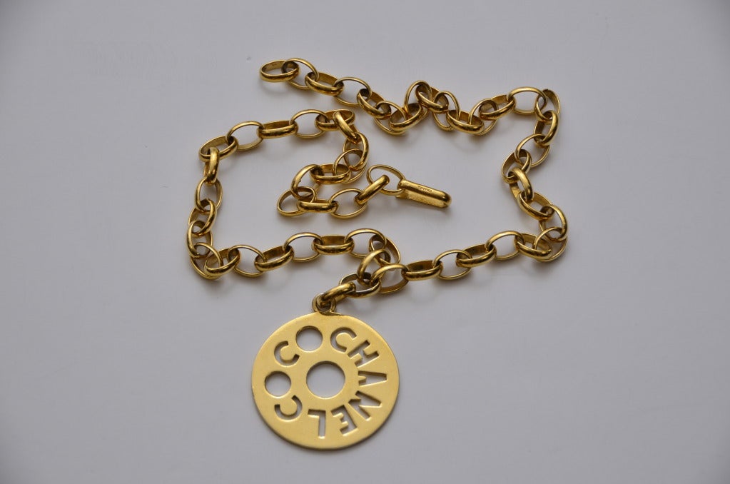 Chanel necklace with open work design COCO CHANEL pendant.Singed Chanel on the clasp.Excellent vintage condition.Pendant measure:2