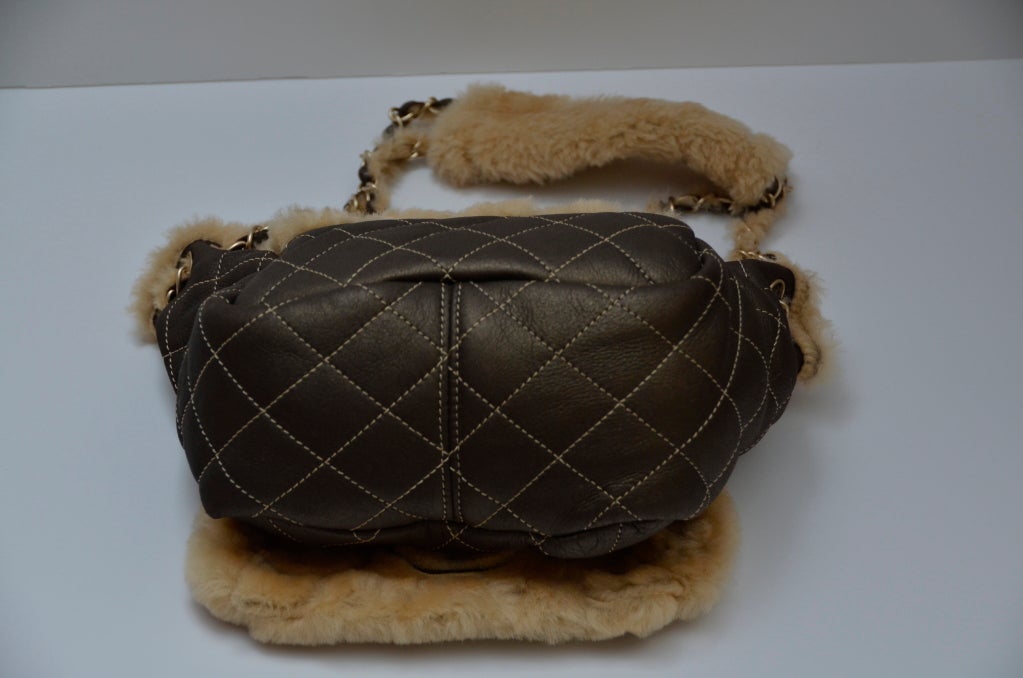 Chanel Vintage Mini Shearling Handbag '04 New.
This rare Chanel handbag is very cute and charming.
New with tags.Hologram and dust bag included.Card not included.
Color in person is like green/pewter mix with little metallic shine to it.

Final