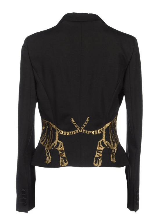 Alexander McQueen Tiger embroidered jacket from 2008 collection.
Composition: 52% Viscose, 48% Virgin Wool
Amazing and RARE piece from the Alexander McQueen Fall 2008 collection.   Superb embroidery with sequins and rhinestones at the center of