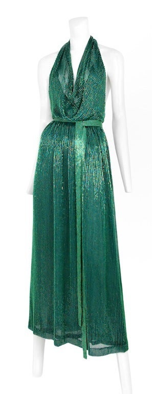 Emerald green bead encrusted halter gown with matching beaded belt.