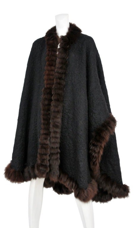 Black brushed wool cape with fox fir trim.