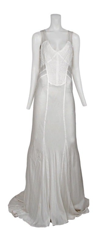 White satin and embroidered cotton wedding gown with chiffon straps.