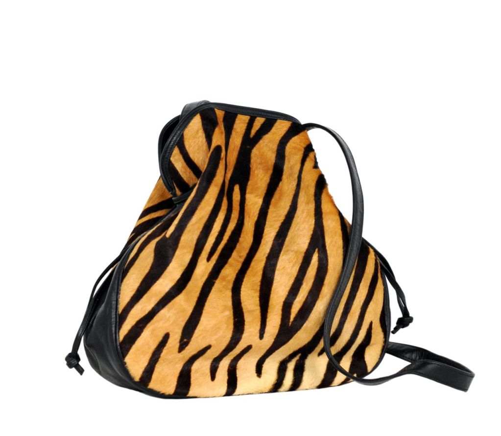 Tiger printed pony fur cross body satchel with leather sides and strap.