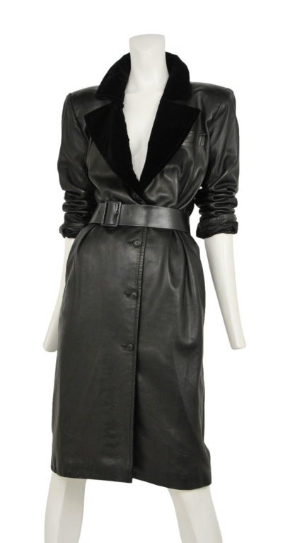 Soft lambskin leather coat dress with black velvet lapels and wide waist belt. Deep V neckline and sharp straight shoulders.