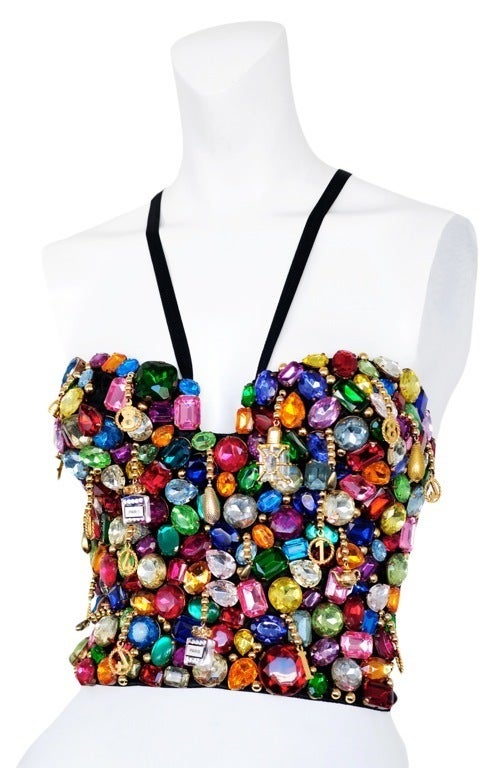 Jewel and charm encrusted bustier top with hook and eye closures at back.